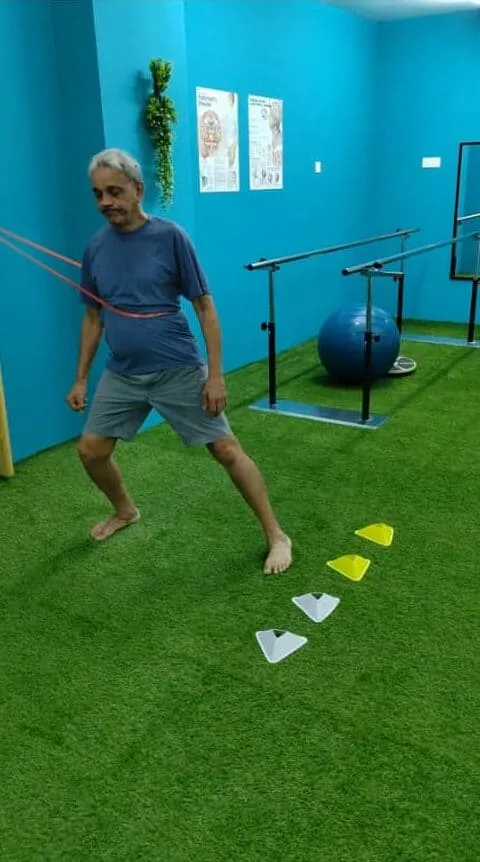 Patient receiving hands-on guided therapy from physiotherapist at Kinesio Rehab