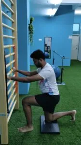 Patient walking with resistance bands and cones for hip and glute strengthening